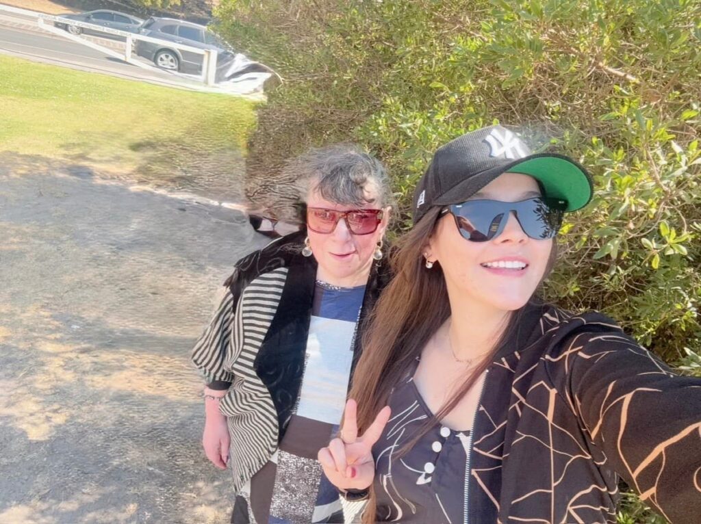 NDIS participant smiling while engaging in a positive support activity