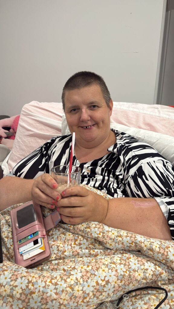 NDIS participant smiling while engaging in a positive support activity